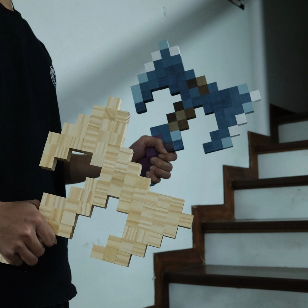 Comparison of handmade wooden Minecraft Cursed Axe with natural wood axe held side by side.