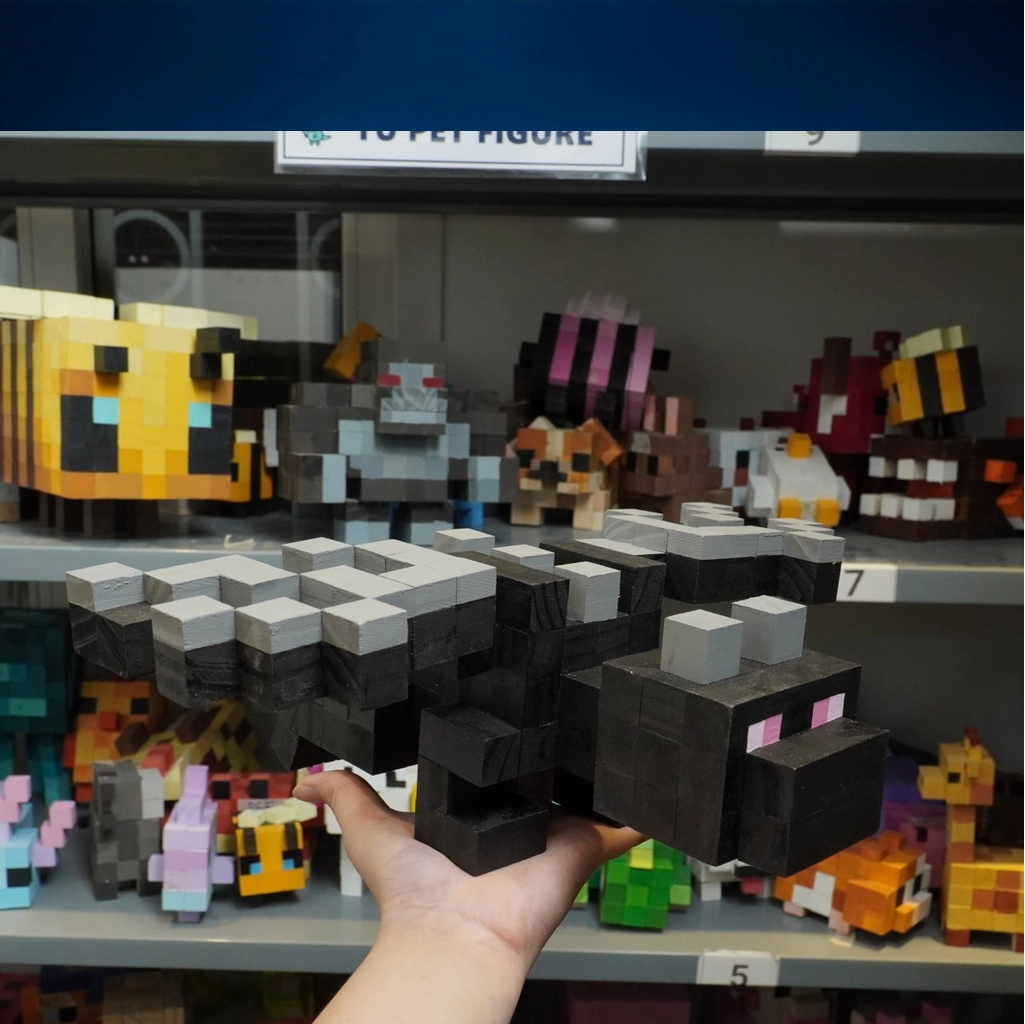 Wooden Minecraft Ender Dragon collectible displayed among other pixel wood toys.
